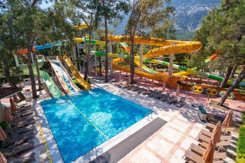 a pool at a water park with a water slide at Akka Antedon Hotel - Premium Ultra All Inclusive in Beldibi