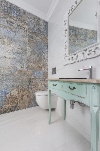 a bathroom with a sink and a mirror at Amelie - Charming Townhouse in the heart of Rabat in Rabat
