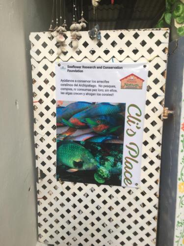 a poster on a wall with a picture of a fish at Cli´s Place Posada Nativa in San Andrés