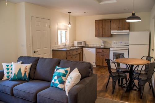 a living room with a couch and a table at Eagle Cap Chalets in Joseph