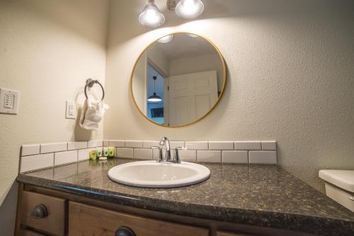 a bathroom with a sink and a mirror at Eagle Cap Chalets in Joseph