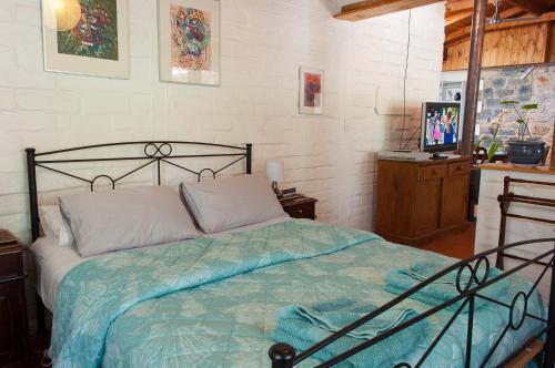 A bed or beds in a room at Trevalia Accommodation