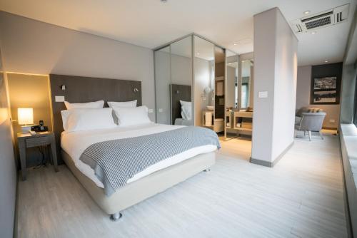 Postel nebo postele na pokoji v ubytování Hotel CityFlats