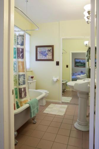 a bathroom with a tub and a sink and a toilet at Rustridge Ranch & Winery in St. Helena