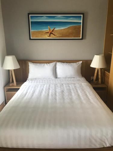 Кровать или кровати в номере Two Bedrooms Apartment with Sea View