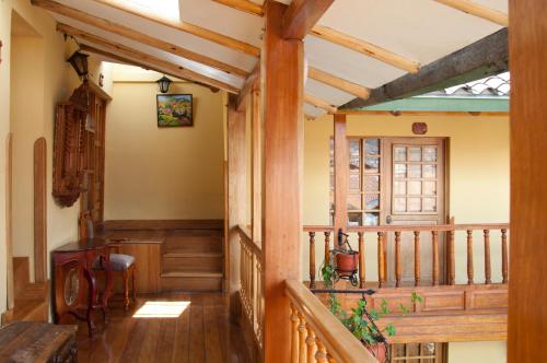 a hallway of a house with wooden beams at Amaru Inca in Cusco