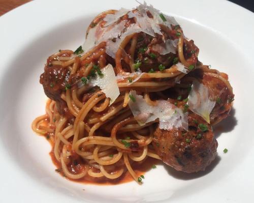 a plate of spaghetti and meatballs on a plate at Commercial Hotel Motel Lithgow in Lithgow