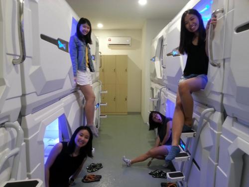 a group of girls standing in a hospital room at Space Cap Hotel in Kota Kinabalu