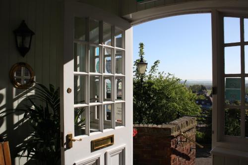 an open door to a house with a view at The Hope Anchor in Rye