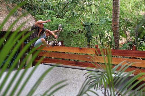 a man doing a trick on a skateboard on a ramp at Pipes Hostel in Kuta Lombok
