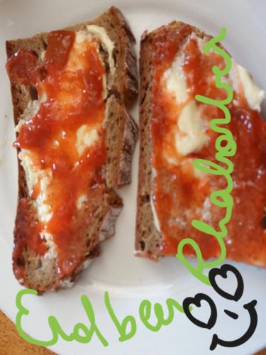 two slices of bread with sauce on a plate with a happy birthday at Gästehaus Auszeit in Unterlamm