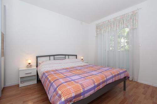 מיטה או מיטות בחדר ב-Apartments Palaziol