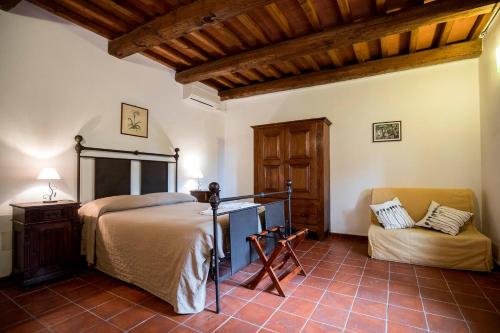 Кровать или кровати в номере Agriturismo Podere S. Croce