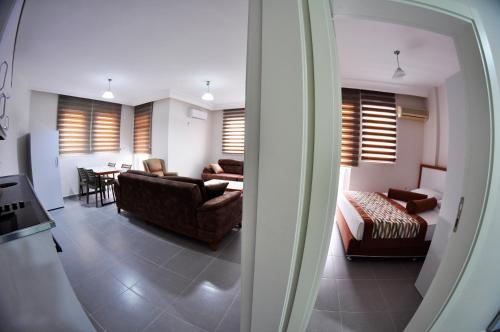 Ένα ή περισσότερα κρεβάτια σε δωμάτιο στο Evon Otel