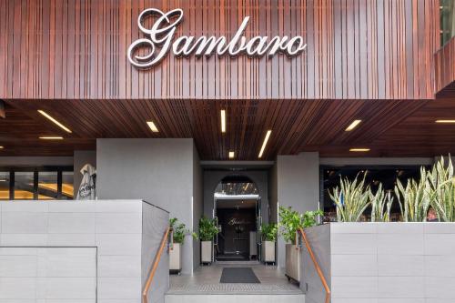 a building with a sign on the front of it at Gambaro Hotel Brisbane in Brisbane