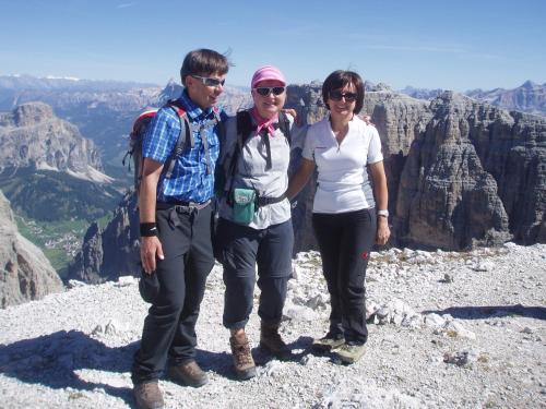 three people standing on the top of a mountain at Appartamento Puez in Selva di Val Gardena
