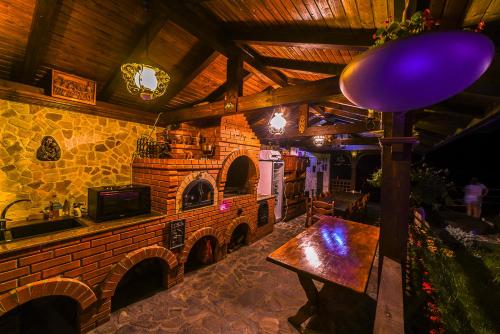 a kitchen with a brick oven in a room at Casa Andrei in Orşova