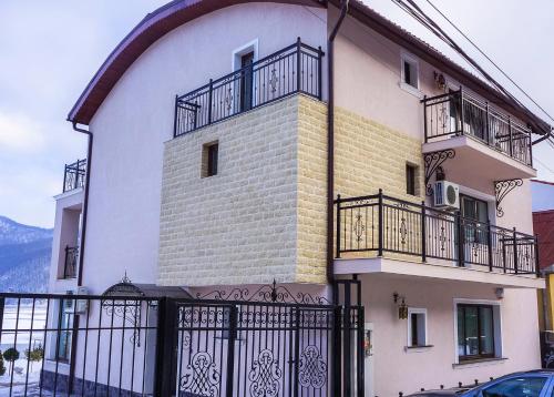 a large building with balconies on the side of it at Casa Andrei in Orşova