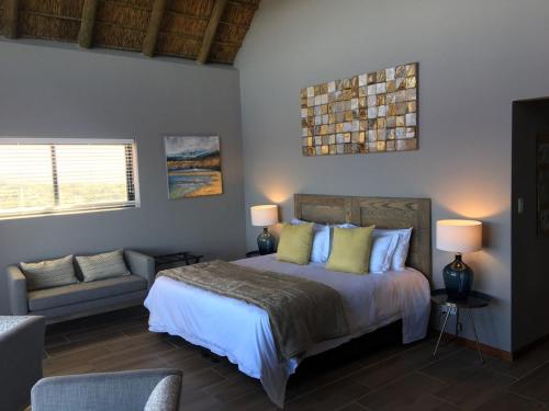 Ένα ή περισσότερα κρεβάτια σε δωμάτιο στο Jbay Zebra Lodge