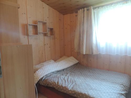 Posteľ alebo postele v izbe v ubytovaní Mazurskie Wzgórze