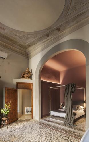 Postel nebo postele na pokoji v ubytování Casa Botticelli