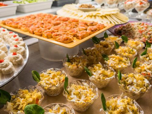 a buffet with many different types of food on display at Golden Port Salou & Spa in Salou