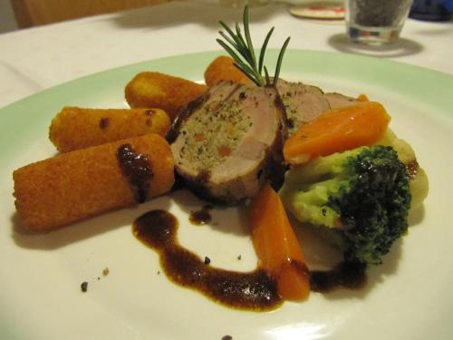 a plate of food with meat and vegetables on a table at Landhotel Eibl in Röhrnbach