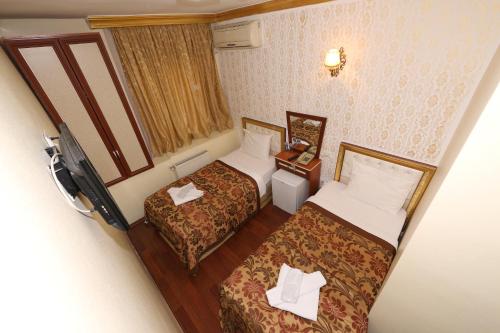 an overhead view of a hotel room with two beds at Meddusa Hotel in Istanbul