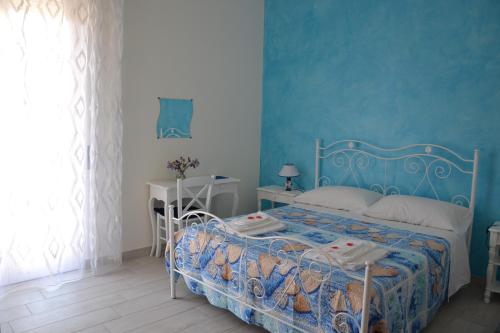 Ένα ή περισσότερα κρεβάτια σε δωμάτιο στο B&B Licata SottoLeStelle