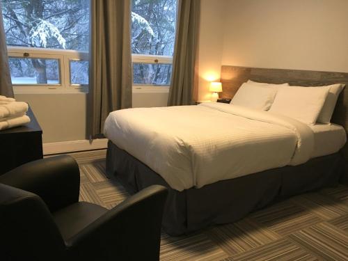 Katil atau katil-katil dalam bilik di Auberge Valcartier