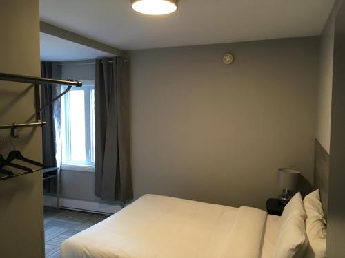 Katil atau katil-katil dalam bilik di Auberge Valcartier