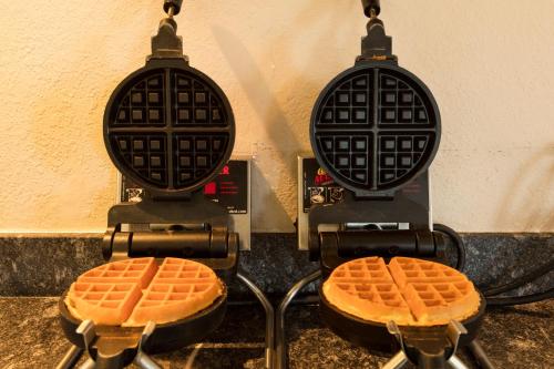 two waffles are cooking on a stove top at Amelia Hotel at the Beach in Fernandina Beach