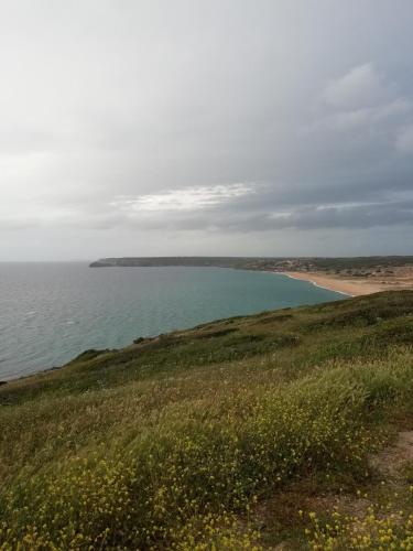 a view of a beach with a body of water at B&B S'Apposentu in Arbus