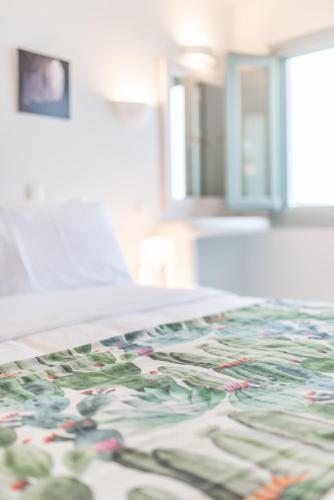 a room with a colorful rug on the floor at Agave Santorini Design Boutique Hotel in Imerovigli