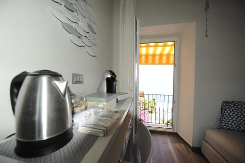 a tea kettle sitting on a counter in a kitchen at Le Storie di Manarola in Manarola