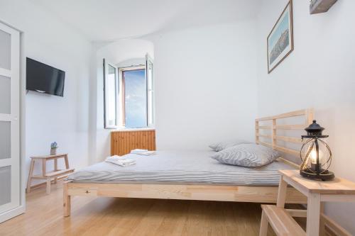 Ein Bett oder Betten in einem Zimmer der Unterkunft Studio Apartman Vedran