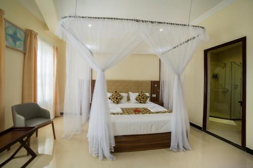 Katil atau katil-katil dalam bilik di Spice Palace Hotel