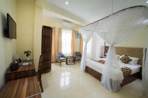 Katil atau katil-katil dalam bilik di Spice Palace Hotel