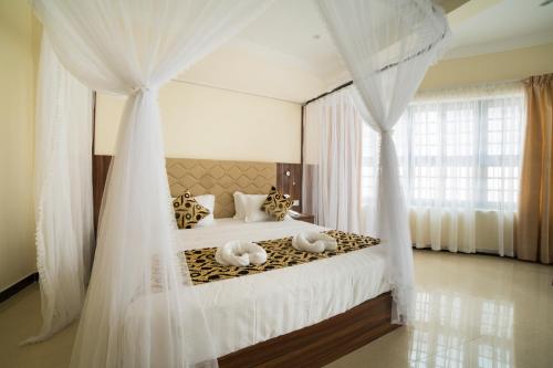 Katil atau katil-katil dalam bilik di Spice Palace Hotel