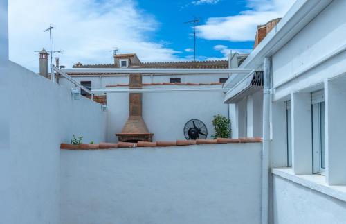 a view of a white building from a balcony at Ca La Josefa in Balaguer