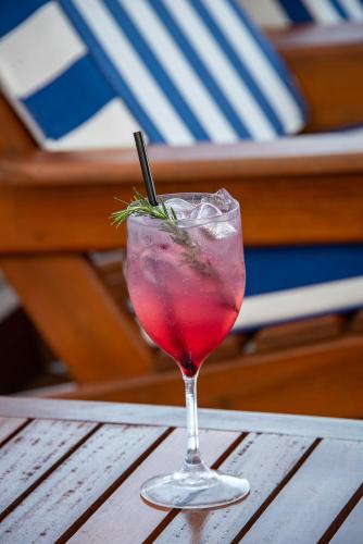 a drink in a glass sitting on a table at Le Relais La Borie in Búzios