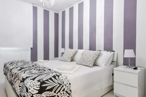 Katil atau katil-katil dalam bilik di Resilienza Tropical Apartments & Room