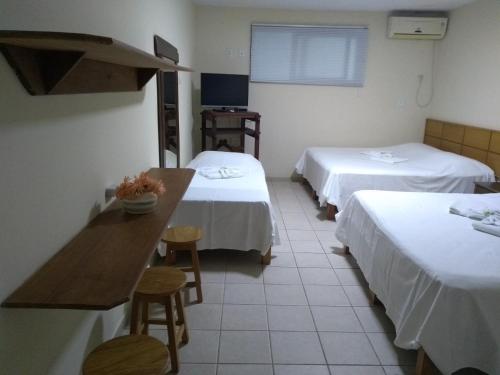 Postel nebo postele na pokoji v ubytování Summer Hotel