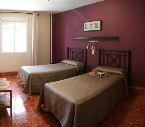 Postel nebo postele na pokoji v ubytování Hostal Jentoft