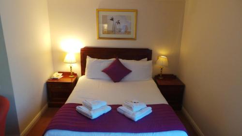 Letto o letti in una camera di La Trelade Hotel