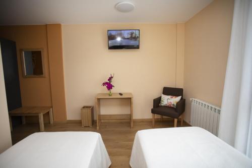 Cama o camas de una habitación en Hotel Novoa