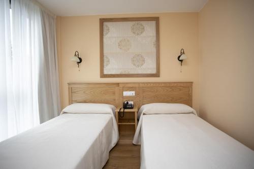 Cama o camas de una habitación en Hotel Novoa