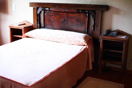 Ένα ή περισσότερα κρεβάτια σε δωμάτιο στο Hotel Monumento Pazo do Castro