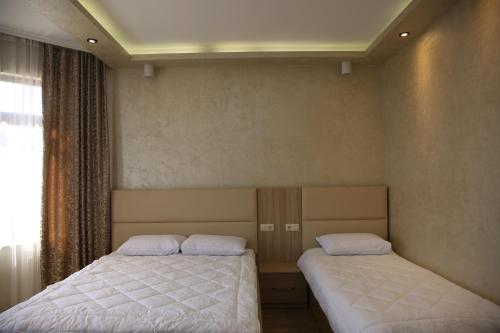 Postel nebo postele na pokoji v ubytování Villa Mariana