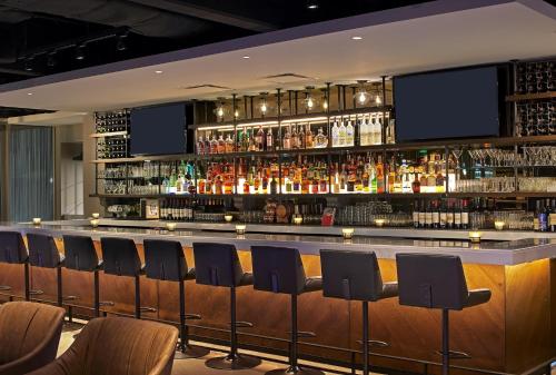 a bar with a lot of drinks on it at Revere Hotel Boston Common in Boston